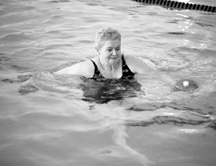 photo of large woman exercising in water