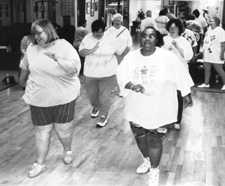 picture of several large women walking in place